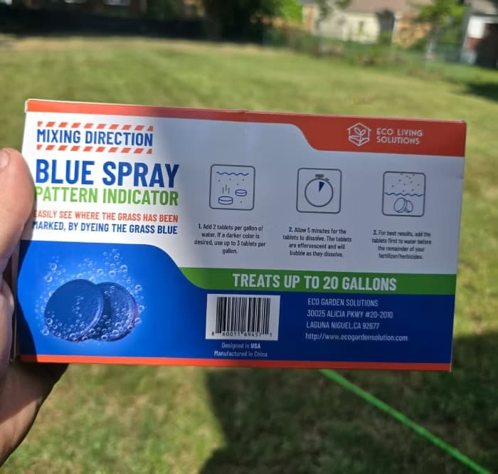 Back of a "Blue Spray Pattern Indicator" box showing mixing directions — 2 tablets per gallon of water, dissolve 5 minutes, add before herbicide; treats up to 20 gallons.