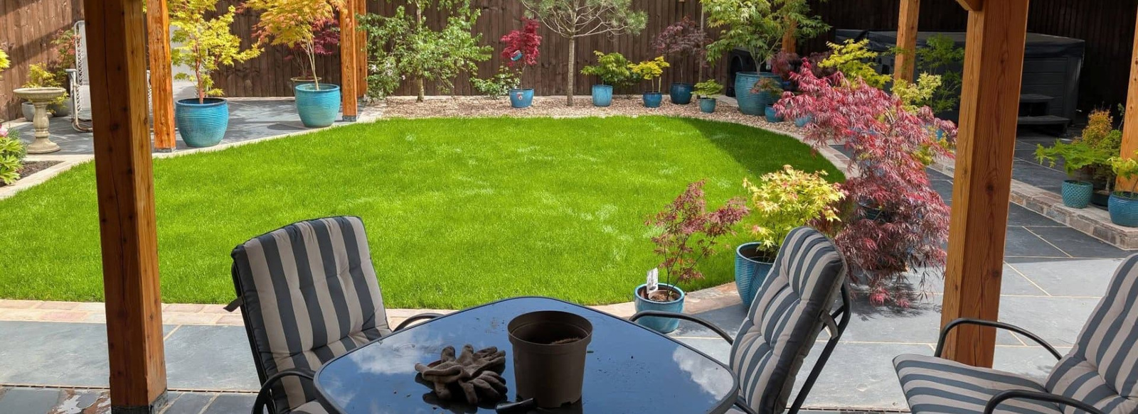 Laptop browsing My Fine Yard on top of a residential lawn.